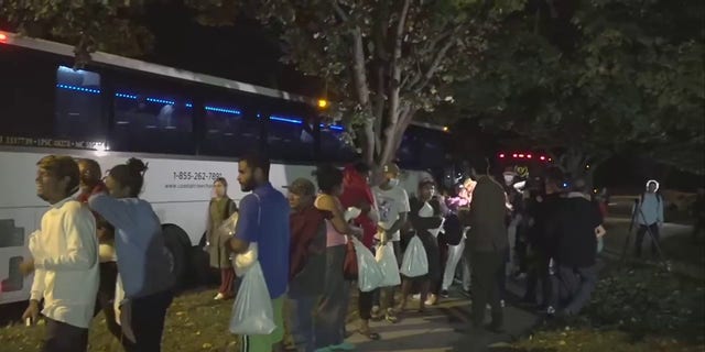 A bus carrying migrants arrived in Washington, D.C., near Vice President Kamala Harris' residence on Oct. 6, 2022.