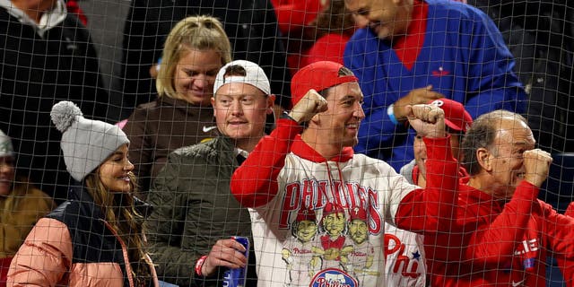 Actor Miles Teller, center, reacts during the seventh inning between the Philadelphia Phillies and the San Diego Padres in Game 4 of the National League Championship Series at Citizens Bank Park Oct. 22, 2022, in Philadelphia. 