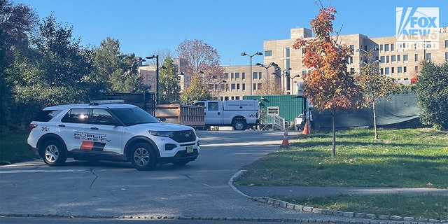 Police and Department of Public Safety vehicles parked off Faculty Road between Hibben Magic Road and Washington Road at Princeton University in New Jersey.