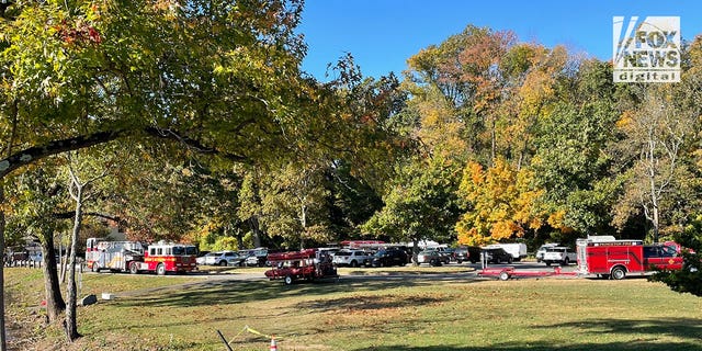 Princeton rescue personnel seen gathering near Carnegie Lake and the Class of 1887 Boathouse on the Princeton University campus. 