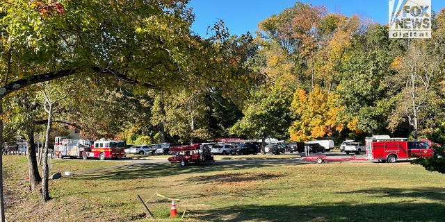 Princeton rescue personnel seen gathering near Carnegie Lake and the Class of 1887 Boathouse on the Princeton University campus.