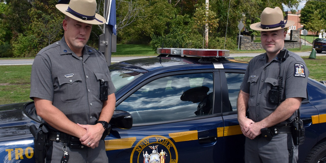 New York State Police troopers Michael J. Winkelman and James P. Flynn-Kocourek rescued a 17-year-old from a burning car in Wappinger on Sept. 22.