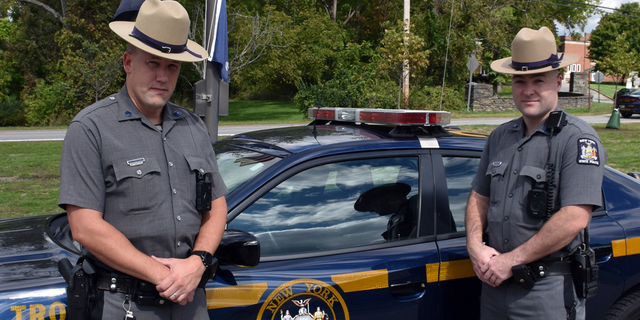 New York State Police officers Michael J. Winkelman and James P. Flynn Coclek rescued a 17-year-old boy from a burning car in Wappinger on Sept. 22.