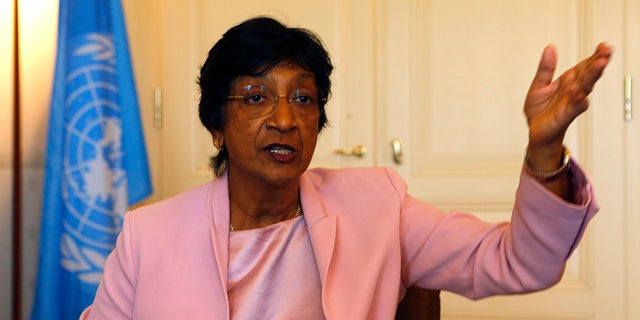 Outgoing U.N. Human Rights Commissioner Navi Pillay talks during an interview to Reuters in her office in Geneva August 19, 2014. Clashes between police and protesters in the U.S. town of Ferguson are reminiscent of the racial violence spawned by apartheid in her native South Africa, Pillay said on Tuesday. (REUTERS/Ruben Sprich)
