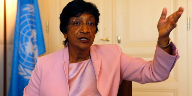 Outgoing U.N. Human Rights Commissioner Navi Pillay talks during an interview to Reuters in her office in Geneva August 19, 2014. Clashes between police and protesters in the U.S. town of Ferguson are reminiscent of the racial violence spawned by apartheid in her native South Africa, Pillay said on Tuesday. (REUTERS/Ruben Sprich)