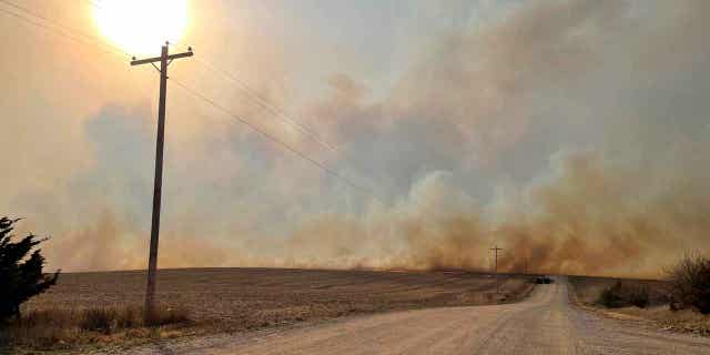 Smoke rises from a grass fire just east of Olive Creek State Recreation Area in southwestern Lancaster County on Oct. 23, 2022. Wind-driven grass fires sweeping through southern Lancaster and northern Gage counties in Nebraska prompted evacuation orders. 