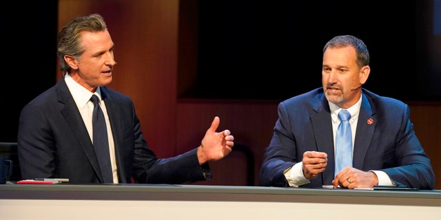 Gubernatorial candidates, Democratic Gov. Gavin Newsom, left, and Republican challenger state Sen. Brian Dahle spar during their debate held by KQED Public Television in San Francisco, on Sunday, Oct. 23, 2022.