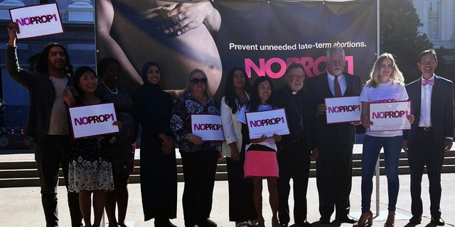 Attendees at the No on Prop. 1 press conference at the state Capitol in Sacramento, California, on Oct. 6, 2022.