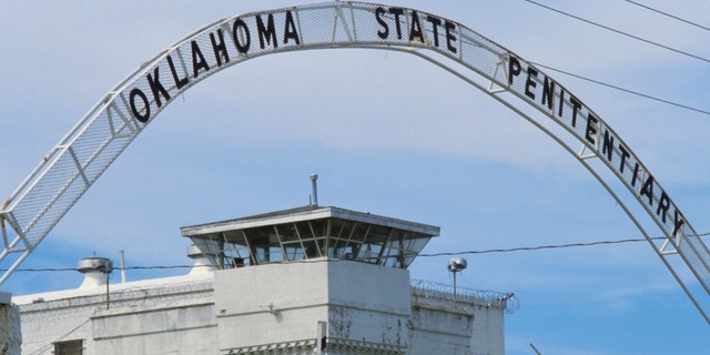 Entrance sign and guard tower at the Oklahoma State Penitentiary