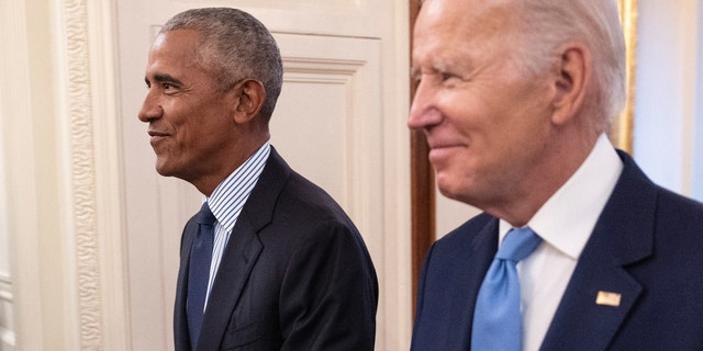 Former President Barack Obama and President Joe Biden arrive at a ceremony to unveil the official Obama White House portraits at the White House on September 7, 2022, in Washington, DC. 
