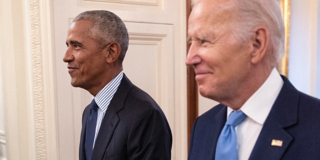 Former President Barack Obama and President Joe Biden arrive at a ceremony to unveil the official Obama White House portraits at the White House on September 7, 2022, in Washington, DC. 