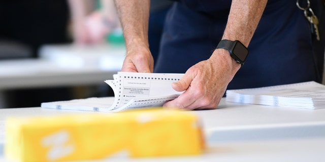 County officials perform a ballot recount on June 2, 2022, in West Chester, Pennsylvania.
