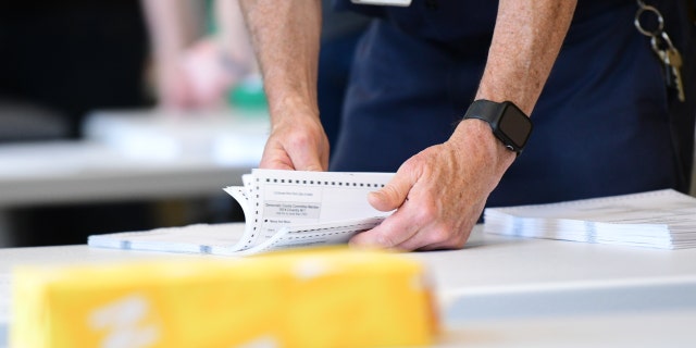 County officials perform a ballot recount on June 2, 2022, in West Chester, Pennsylvania.