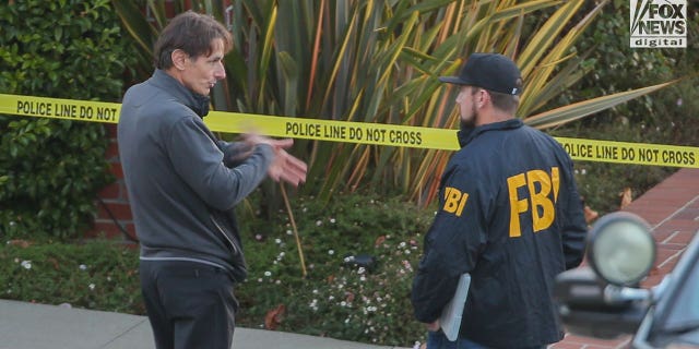 Paul Pelosi Jr. speaks to FBI investigators outside the home of his parents Nancy and Paul Pelosi, Friday October 28, 2022. His father, Paul was the victim of a violent home invasion earlier this morning.