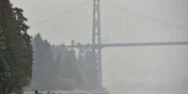 Stanley Park and Lions Gate Bridge are covered in smog from clouds and smoke due to forest fires in Washington, Oregon and California on Sept. 17, 2020.