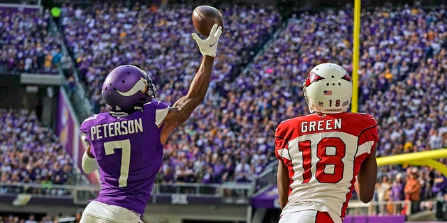 Minnesota Vikings Cornerback Patrick Peterson (7) breaks up a pass intended for Arizona Cardinals wide receiver A.J. Green (18) during the first quarter of a game Oct. 30, 2022, at U.S. Bank Stadium in Minneapolis.
