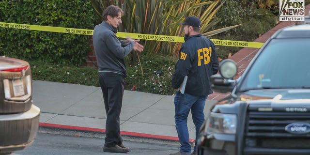 Paul Pelosi Jr. speaks to FBI investigators outside the home of his parents Nancy and Paul Pelosi, Friday October 28, 2022. His father, Paul was the victim of a violent home invasion earlier this morning.