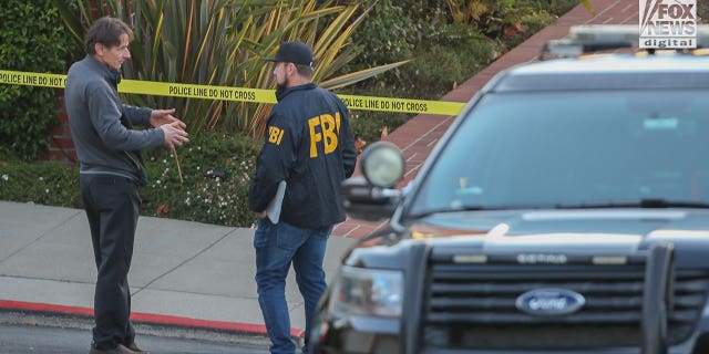 Paul Pelosi Jr. speaks to FBI investigators outside the home of his parents Nancy and Paul Pelosi, Friday, October 28, 2022. His father, Paul was the victim of a violent home invasion earlier this morning.