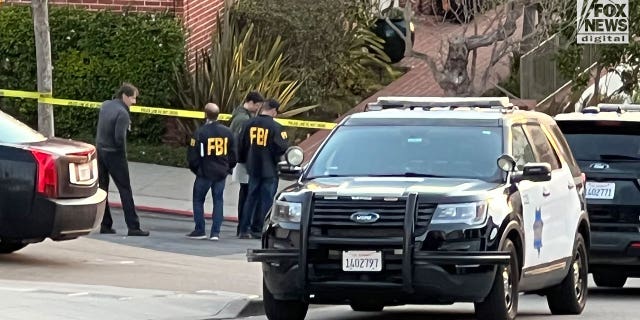 FBI investigators are seen outside the home of Nancy and Paul Pelosi where Paul was the victim of a violent home invasion, Friday, Oct. 28, 2022.