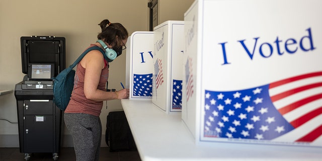 A voter casts a ballot at a polling location in Pittsburgh, Pennsylvania, on Tuesday, May 17, 2022. 