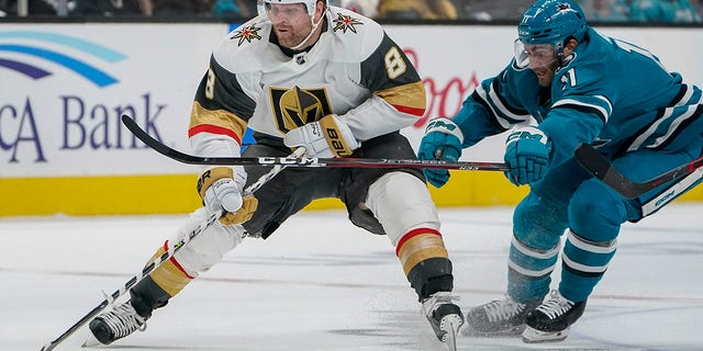 San Jose Sharks center Luke Kunin, #11, chases after Vegas Golden Knights center Phil Kessel, #8, during the second period of an NHL hockey game in San Jose, Calif., Tuesday, Oct. 25, 2022. 