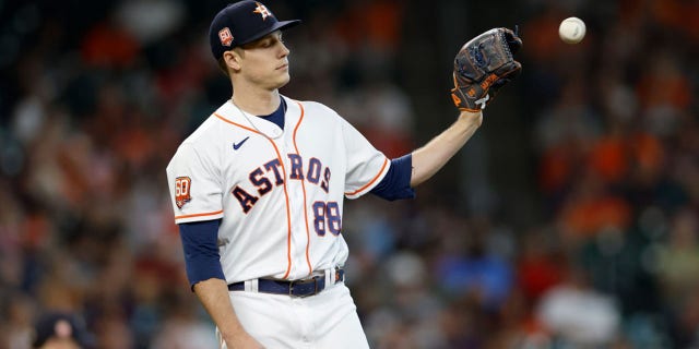 Phil Maton of the Houston Astros reacts to giving up a base hit to brother Nick Maton of the Philadelphia Phillies in the eighth inning at Minute Maid Park Oct. 5, 2022, in Houston.