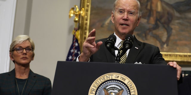 President Joe Biden delivers remarks on Oct. 19 as Energy Secretary Jennifer Granholm listens. The president has ordered the Department of Energy to release oil from the Strategic Petroleum Reserve on multiple occasions to combat high gas prices.