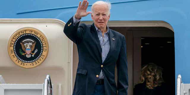 President Joe Biden waves before boarding Air Force One for a trip to Florida to visit areas affected by Hurricane Ian at Andrews Air Force Base, Md., Wednesday, Oct. 5, 2022. 