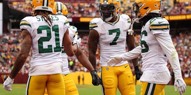 Quay Walker of the Green Bay Packers celebrates with teammates after a play against the Washington Commanders at FedExField on Oct. 23, 2022, in Landover, Maryland.