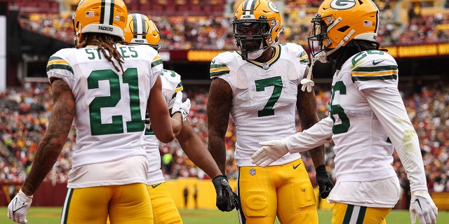 Quay Walker of the Green Bay Packers celebrates with teammates after a game against the Washington Commanders at FedExField on October 23, 2022 in Landover, Maryland.