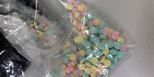 A bag of rainbow-colored fentanyl pills. 