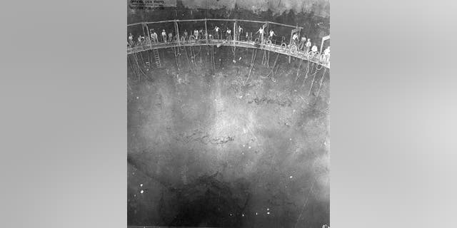 In this file photo provided by the U.S. Army Corps of Engineers, this 1942 Navy photo shows miners building one of the 20 fuel tanks of Defense Logistics Agency's Red Hill Underground Fuel Storage Facility at Joint Base Pearl Harbor, Hawaii, which are connected by a miles-long tunnel.