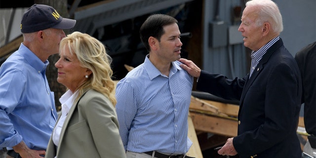 President Biden speaks with Sen. Marco Rubio, R-Fla., and Sen. Rick Scott, R-Fla., prior to meeting with local residents impacted by Hurricane Ian, in Fort Myers, Florida, on Oct/ 5, 2022.