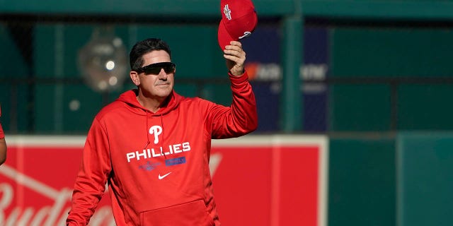 Philadelphia Phillies interim manager Rob Thomson removes his cap during baseball practice Thursday, Oct. 6, 2022, in St. Louis. The Phillies and St. Louis Cardinals are set to play Game 1 of a National League Wild Card baseball playoff series on Friday in St. Louis.