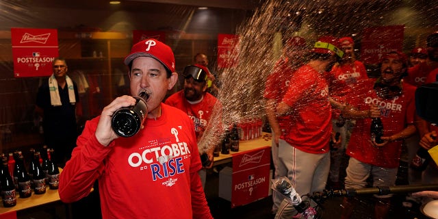 Philadelphia Phillies interim manager Rob Thomson celebrates after the Phillies won a baseball game against the Houston Astros to clinch a wild-card playoff spot, Monday, Oct. 3, 2022, in Houston.