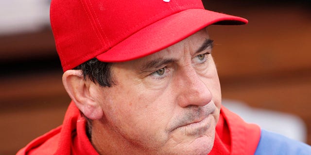Philadelphia Phillies interim manager Rob Thomson manager watches from the dugout before the beginning of a baseball game against the Washington Nationals, Sunday, Oct. 2, 2022, in Washington.