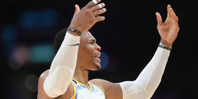 Los Angeles Lakers guard Russell Westbrook cheers on the crowd during an NBA basketball game against the Denver Nuggets, Sunday, Oct. 30, 2022, in Los Angeles.