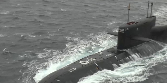The Russian strategic ballistic missile submarine Tula during exercises held by the country's strategic nuclear forces in an unknown location, in this image from a video released on October 26, 2022.