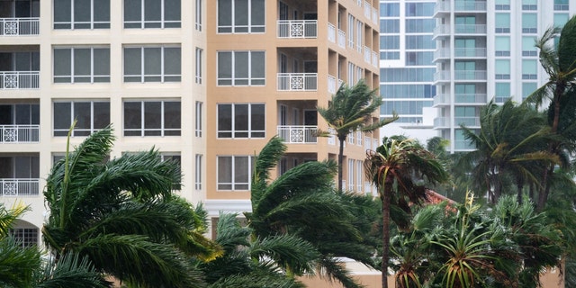 SARASOTA, FL - SEPTEMBER 28: Wind gusts blow between condominiums as Hurricane Ian churns to the south on September 28, 2022 in Sarasota, Florida. The storm made a U.S. landfall at Cayo Costa, Florida this afternoon as a Category 4 hurricane with wind speeds over 140 miles per hour in some areas. 