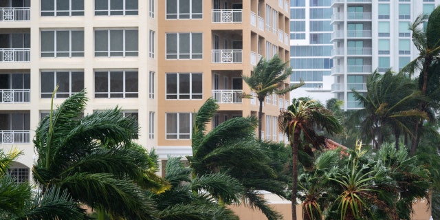 SARASOTA, FL - SEPTEMBER 28: Wind gusts blow between condominiums as Hurricane Ian churns to the south on September 28, 2022 in Sarasota, Florida. The storm made a U.S. landfall at Cayo Costa, Florida this afternoon as a Category 4 hurricane with wind speeds over 140 miles per hour in some areas.