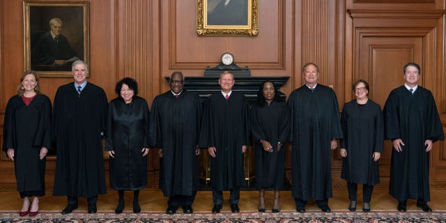 Members of the Supreme Court (L-R) Associate Justices Amy Coney Barrett, Neil M. Gorsuch, Sonia Sotomayor, and Clarence Thomas, Chief Justice John G. Roberts, Jr., and Associate Justices Ketanji Brown Jackson, Samuel A. Alito, Jr., Elena Kagan, and Brett M. Kavanaugh pose in the Justices Conference Room prior to the formal investiture ceremony of Associate Justice Ketanji Brown Jackson September 30, 2022 in Washington, DC. President Joseph R. Biden, Jr., First Lady Dr. Jill Biden, Vice President Kamala Harris, and Second Gentleman Douglas Emhoff attended as guests of the Court. 