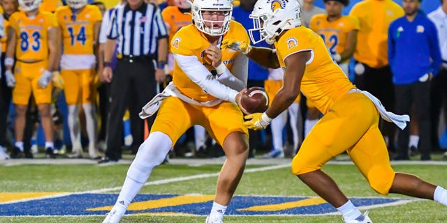 San Jose State Spartans running back Camdan McWright takes a handoff from quarterback Chevan Cordeiro during a game against the UNLV Rebels at CEFCU Stadium in San Jose, California, on Oct. 7, 2022.