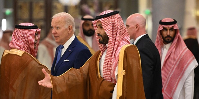 President Joe Biden (C-L) and Saudi Crown Prince Mohammed bin Salman (C) arrive for the family photo during the Jeddah Security and Development Summit (GCC+3) at a hotel in Saudi Arabia's Red Sea coastal city of Jeddah on July 16, 2022. 