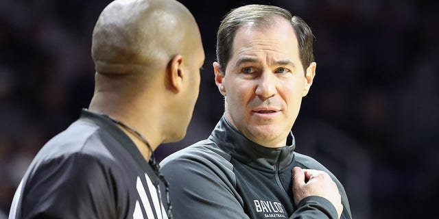 Baylor head coach Scott Drew talks with an official during the game against Kansas State on Feb 9, 2022, at Bramlage Coliseum in Manhattan, Kansas.