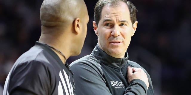 Baylor head coach Scott Drew talks with an official during the game against Kansas State on Feb 9, 2022, at Bramlage Coliseum in Manhattan, Kansas.