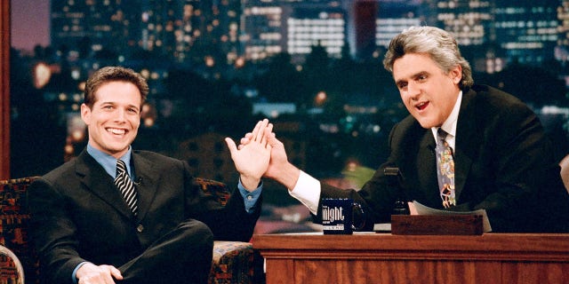 Actor Scott Wolf with host Jay Leno during an interview on November 25, 1996.