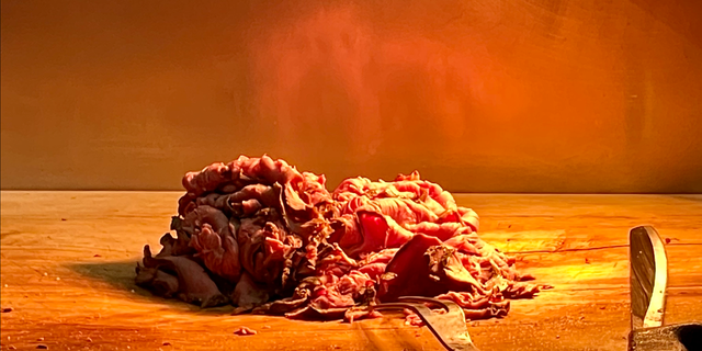 Freshly sliced top of the round is shown on the carving station at Bar-Bill Tavern in East Aurora, New York, a beef on weck hotspot. The sandwiches, a tradition in western New York, are typically carved and prepared behind the bar at local watering holes.