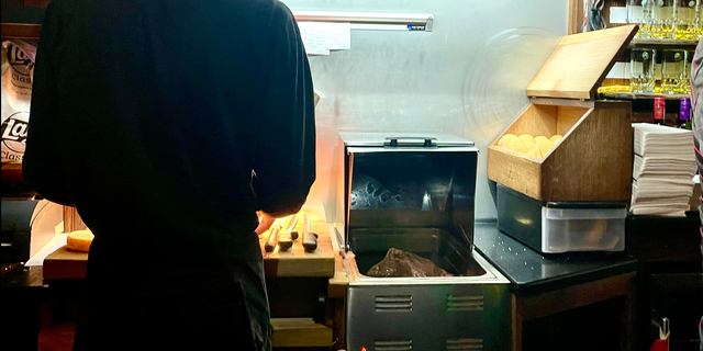 Beef on weck is prepared at a carving station behind the bar at Bar-Bill Tavern in East Aurora, New York, a mecca for the local specialty.