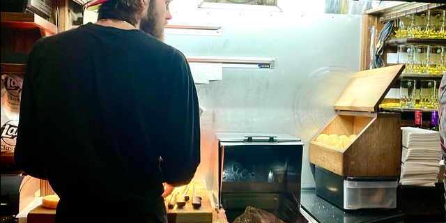 Beef on weck is prepared at a carving station behind the bar at Bar-Bill Tavern in East Aurora, New York, a hotspot for the local specialty.