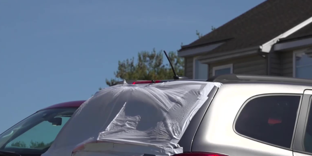 The back window of a vehicle was shot out near the scene.